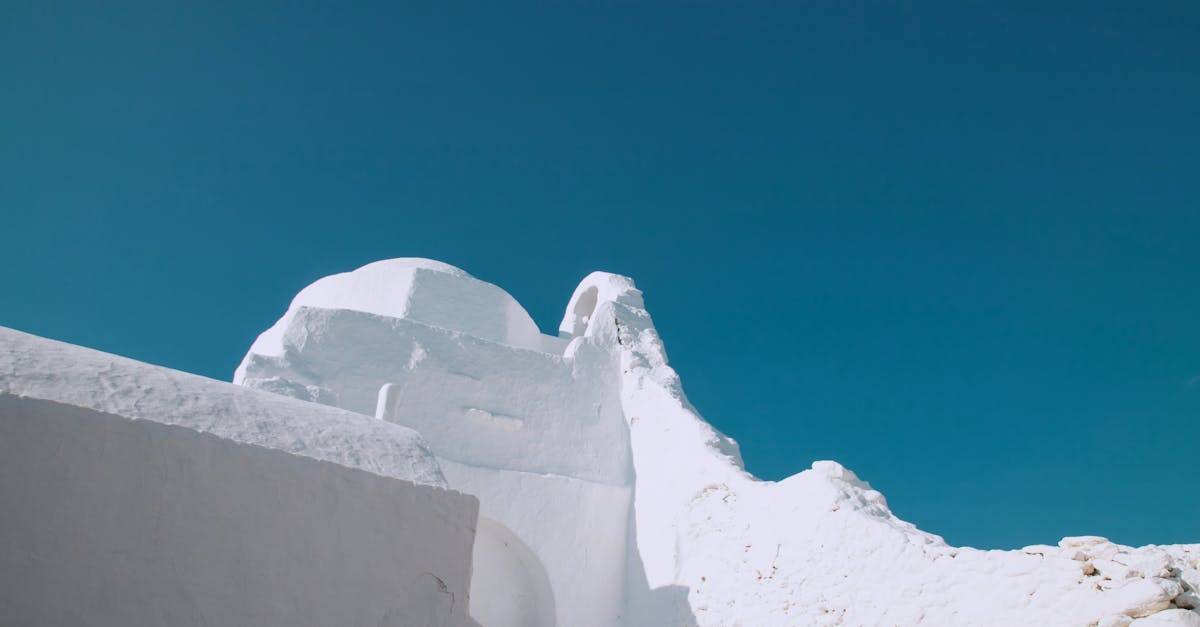 Stunning view of iconic whitewashed buildings in Mykonos under a clear blue sky.